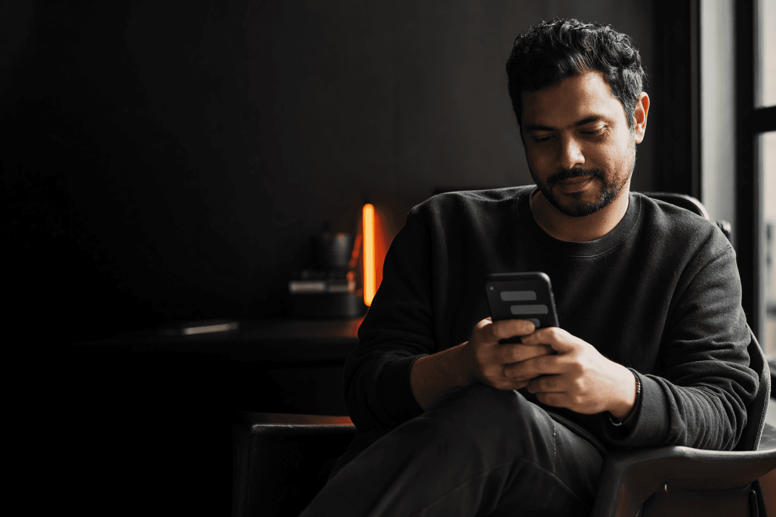 Person engaging in a casual chat conversation on their smartphone, representing the conversational experience of an AI chatbot versus a contact form